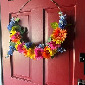 Vibrant Floral Wreath with Blue and Orange Flowers
